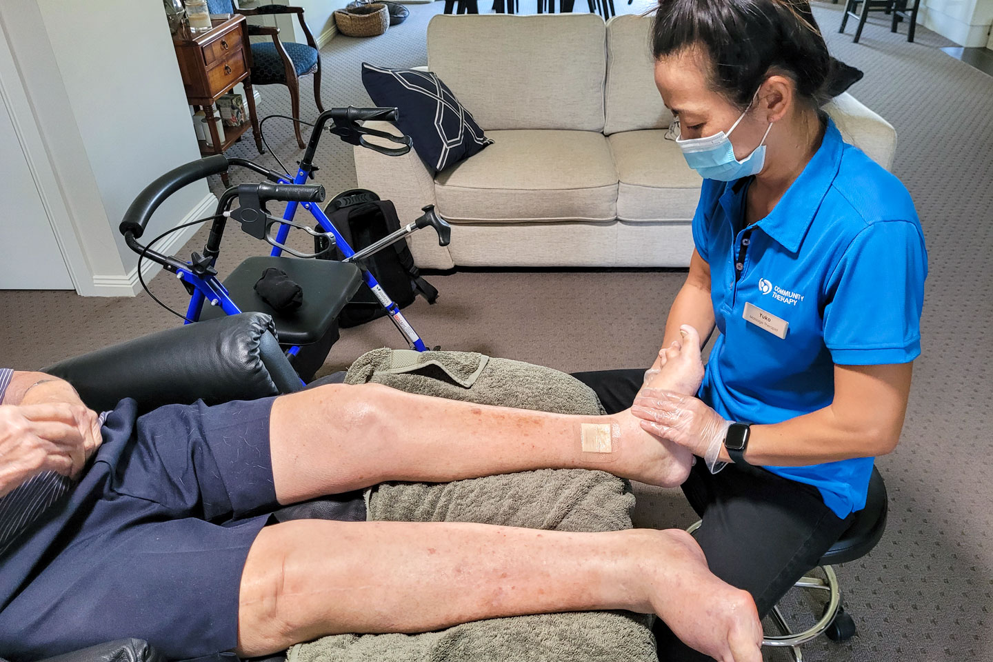 Massage Therapist performing lower limb massage