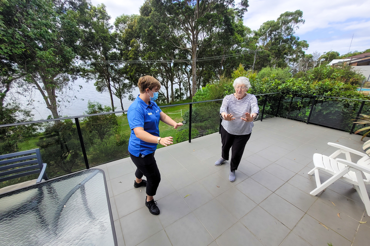 Physiotherapist doing Tai Chi exercises with Home Care client