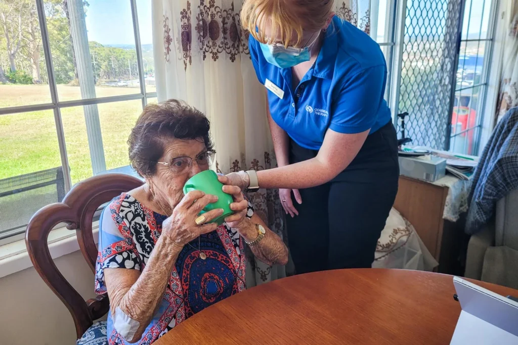 Speech Pathologist performing a swallowing assessment on a Home Care client