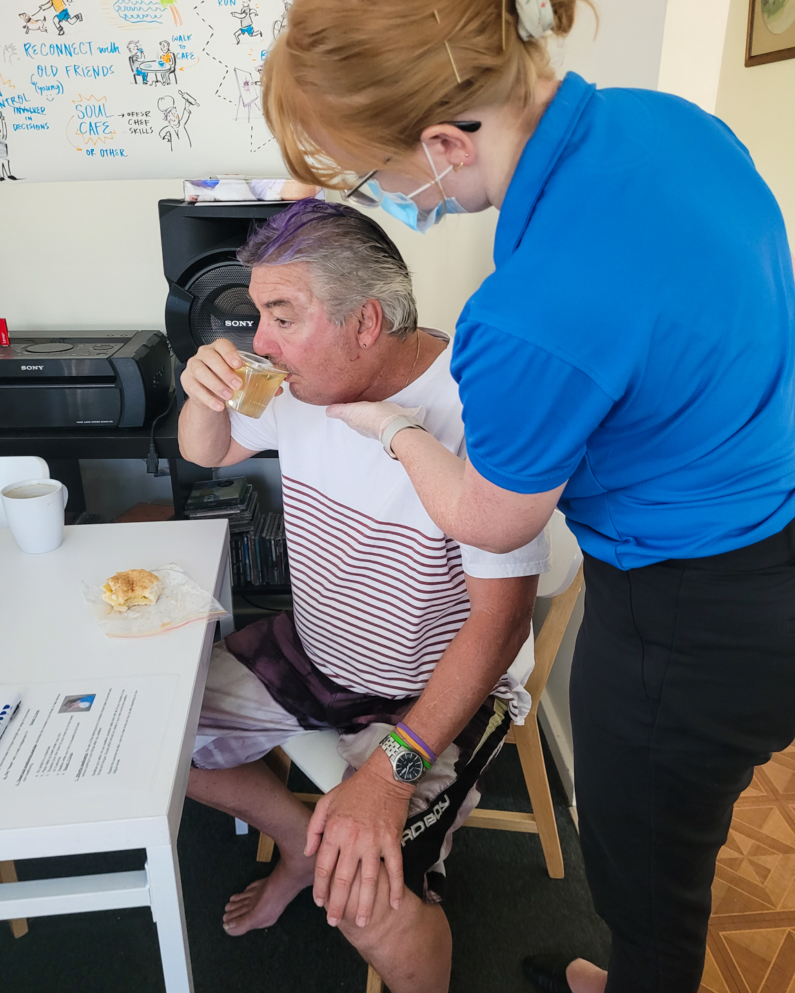 Speech Pathologist conducting a swallowing assessment on an NDIS client